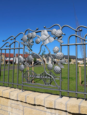 This panel depicts brambles, one of the local street names and the nearby iconic Rail Bridge.