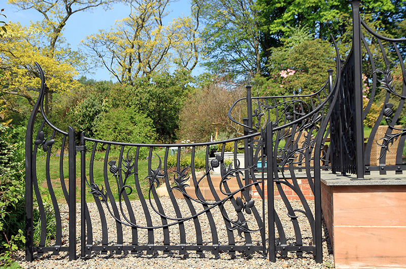 Commissioned by private clients, a garden gate, patio gates, handrails and balustrade for a patio area. The Thistle theme represents the clients love of Scotland, the butterflies their love of gardening and we incorporated dragonflies within the design as a reference to the garden pond.