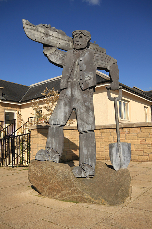 We Carried The Canal. The Moorings, Ratho. The sculpture, commissioned for a new housing development which runs alongside the Union Canal, depicts one of the navvies who built the contour canal in 1822. Forged and fabricated from mild steel with a galvanised acid etched finish.